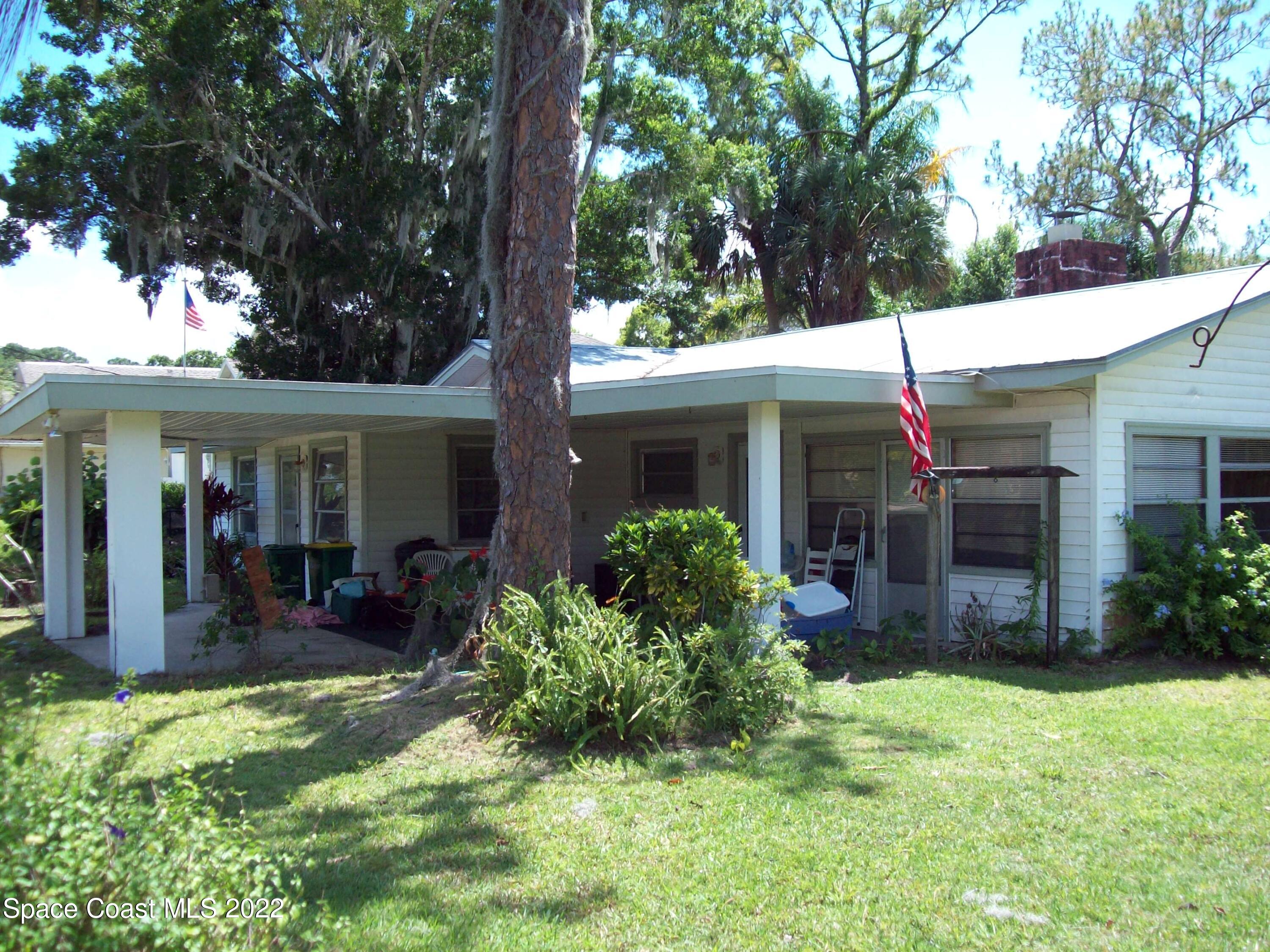 2224 Iowa Street Melbourne, FL 32904 - Photo 6 of 19 a front view of a house with a yard and porch