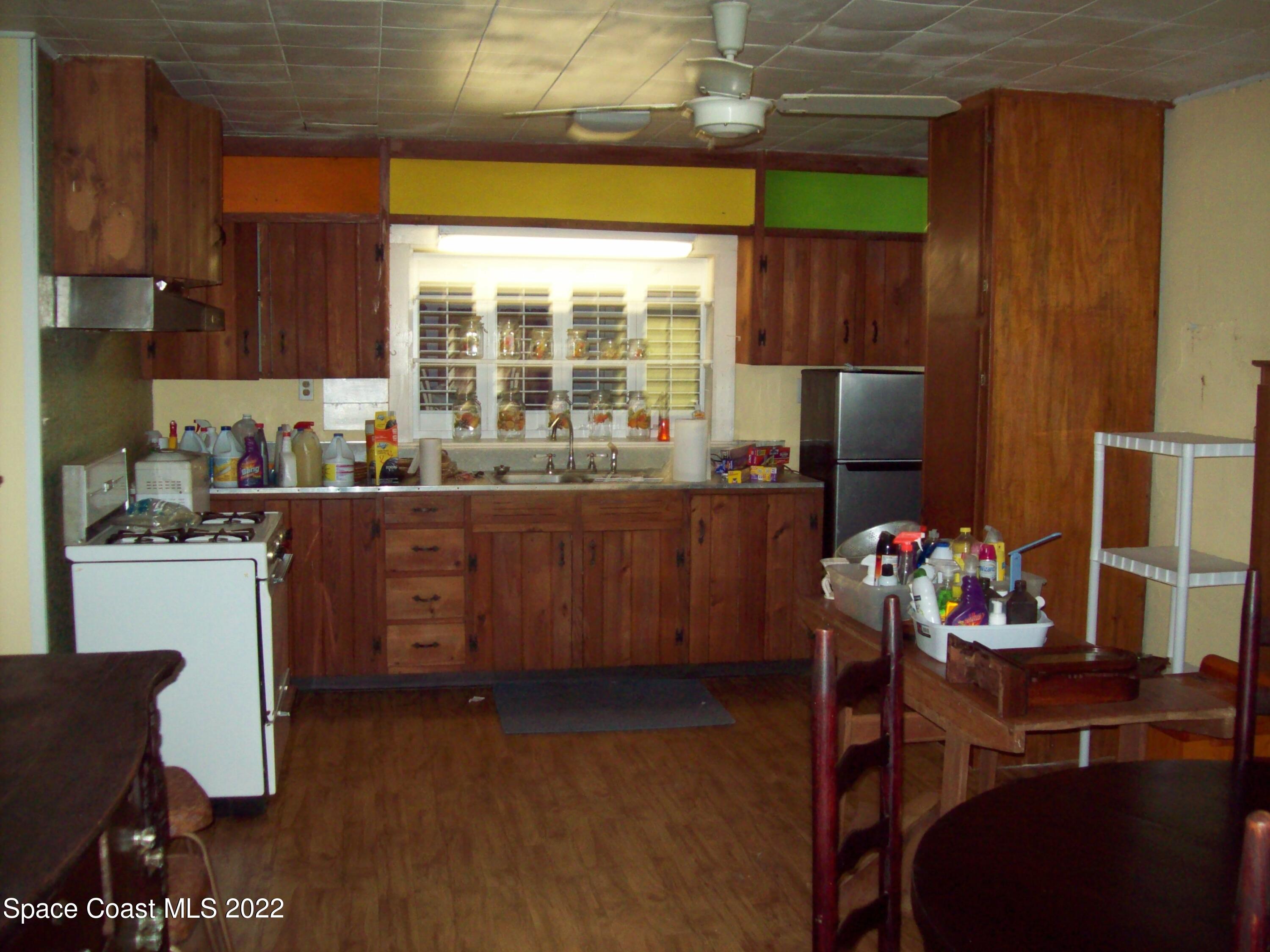 2224 Iowa Street Melbourne, FL 32904 - Photo 8 of 19 a kitchen with a sink appliances and cabinets