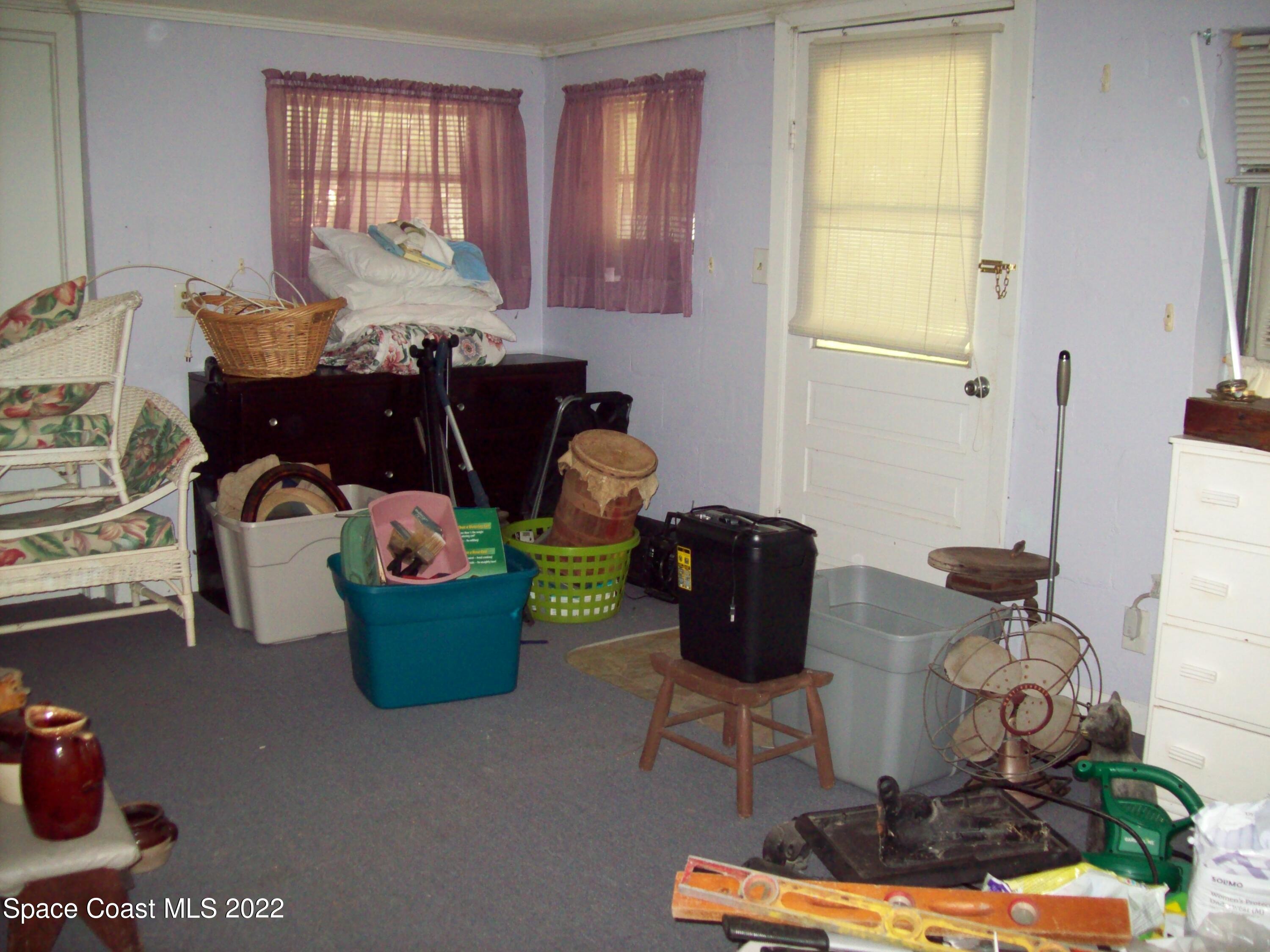 2224 Iowa Street Melbourne, FL 32904 - Photo 10 of 19 a room with furniture a rug and a window