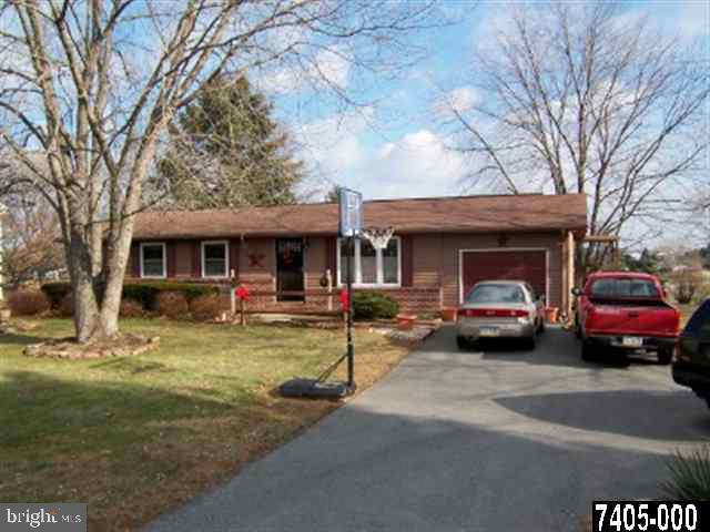 1963 Adair Road, Unit 1 Windsor, PA 17366 - Photo 1 of 1 a view of house that has a car parked in front of it