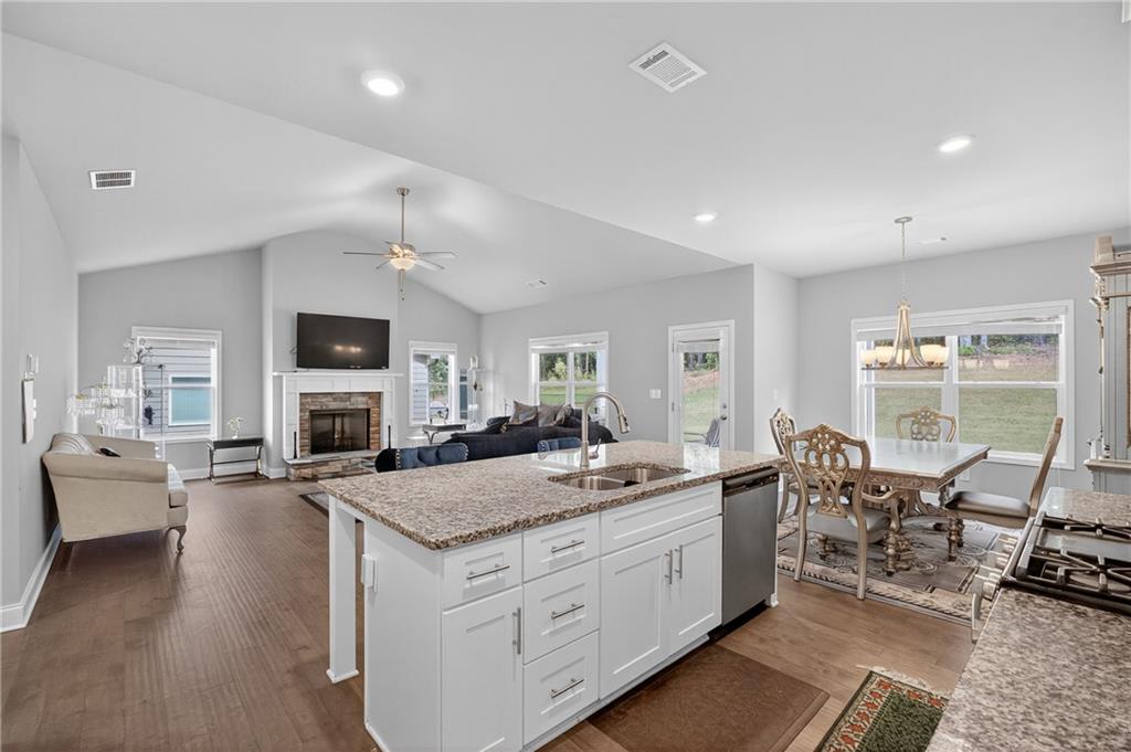 8325 Loch Lomand Lane Winston, GA 30187 - Photo 20 of 31 a kitchen with sink stove and chairs