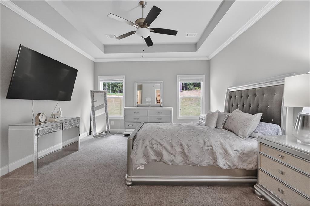 8325 Loch Lomand Lane Winston, GA 30187 - Photo 25 of 31 a bedroom with a bed and a flat screen tv