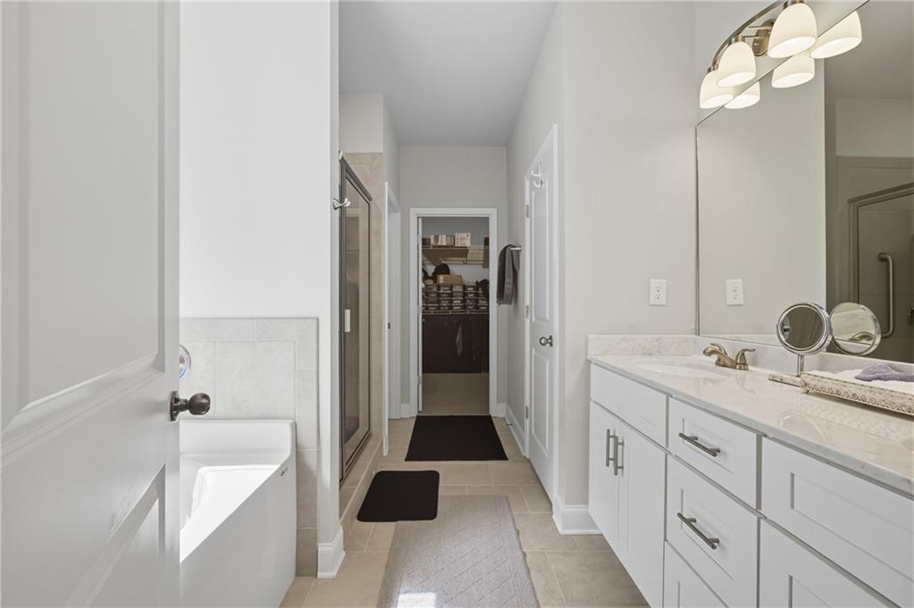 8325 Loch Lomand Lane Winston, GA 30187 - Photo 26 of 31 a spacious bathroom with a tub sink and mirror
