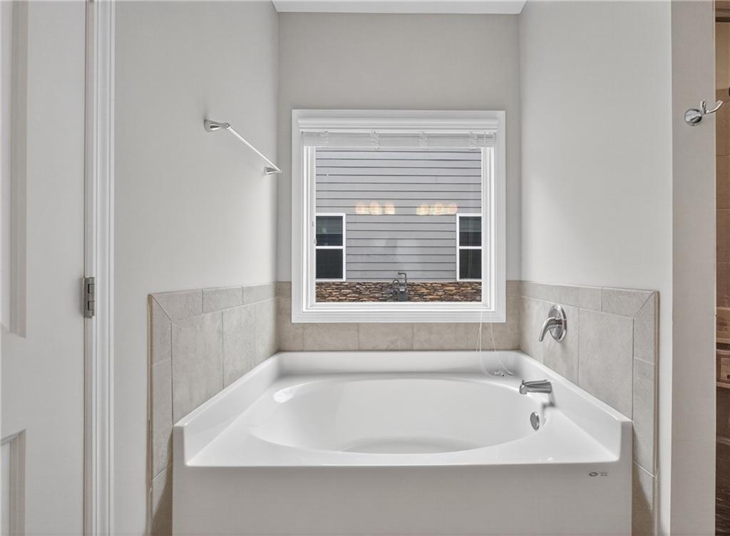 8325 Loch Lomand Lane Winston, GA 30187 - Photo 28 of 31 a white bath tub sitting next to a window