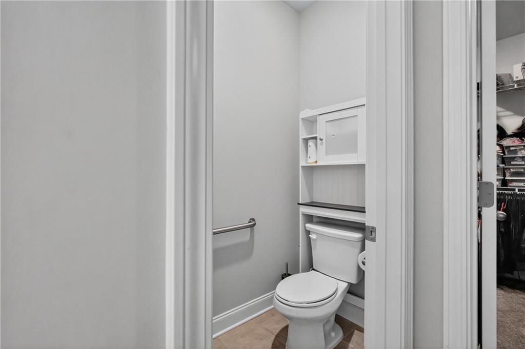 8325 Loch Lomand Lane Winston, GA 30187 - Photo 30 of 31 a bathroom with a granite countertop toilet and a sink