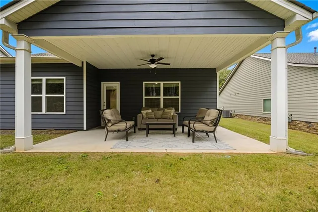 a backyard of a house with seating space