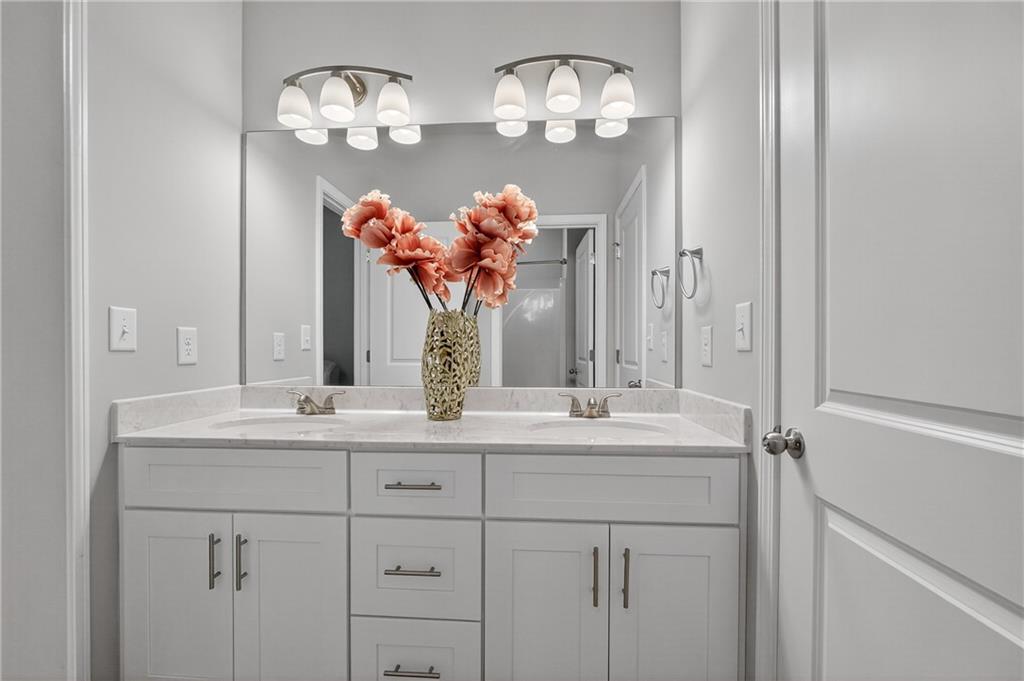 8325 Loch Lomand Lane Winston, GA 30187 - Photo 8 of 31 a bathroom with a sink double vanity and a mirror