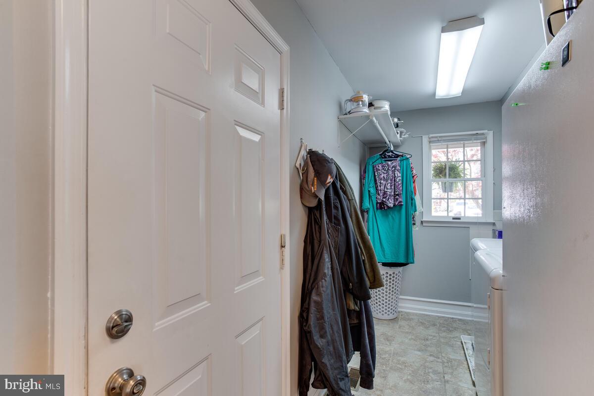 7883 Poplar Grove Road Severn, MD 21144 - Photo 49 of 77 a view of walk in closet with clothes and shoes