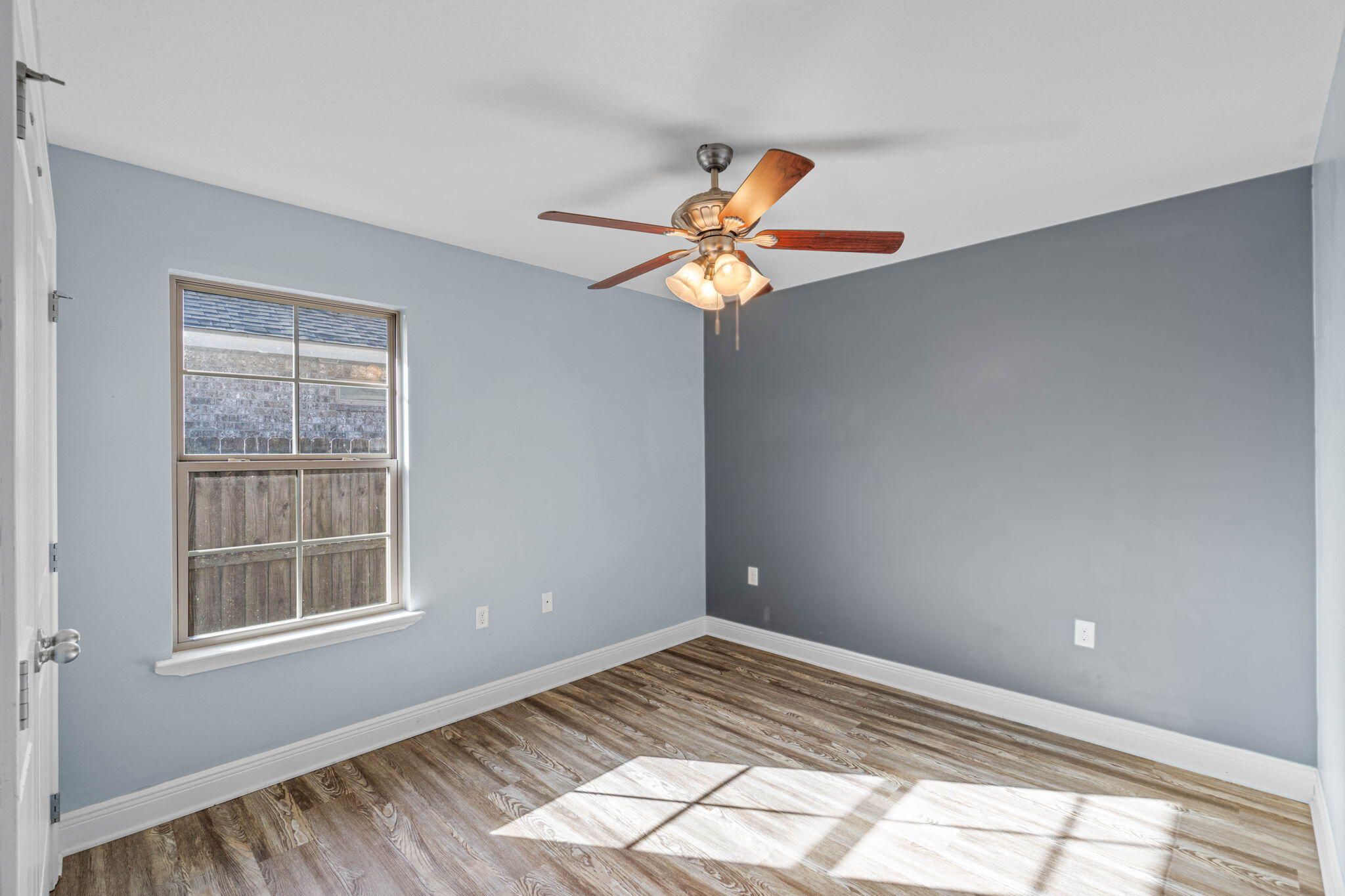 227 January Court Crestview, FL 32539 - Photo 11 of 25 a view of an empty room with a window