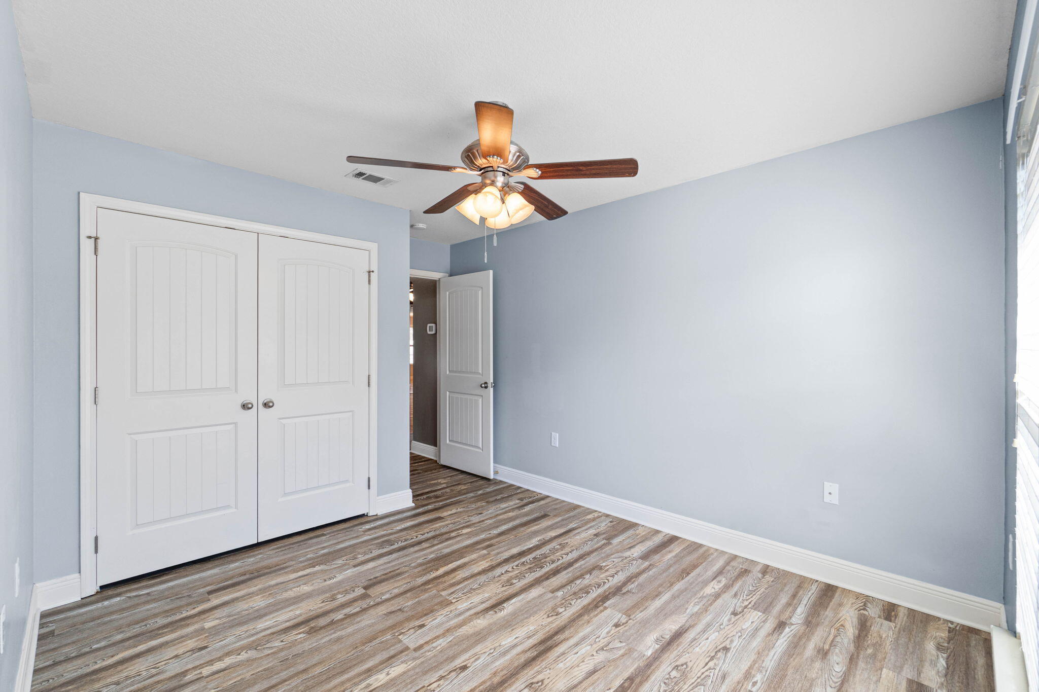 227 January Court Crestview, FL 32539 - Photo 14 of 25 a view of a room with wooden floor