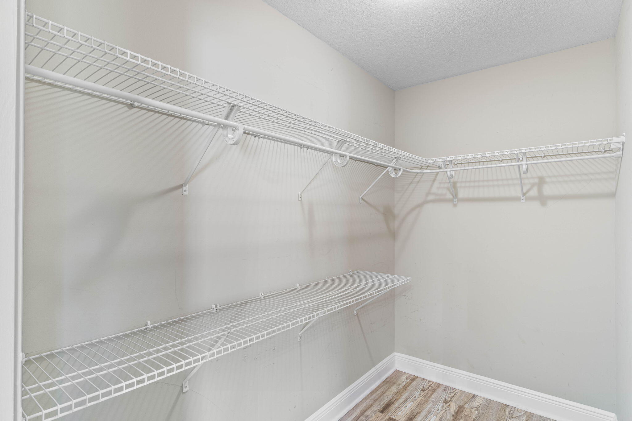 227 January Court Crestview, FL 32539 - Photo 22 of 25 a view of a room with racks on the wall