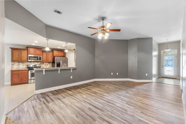 a view of a kitchen with a sink and a stove top oven