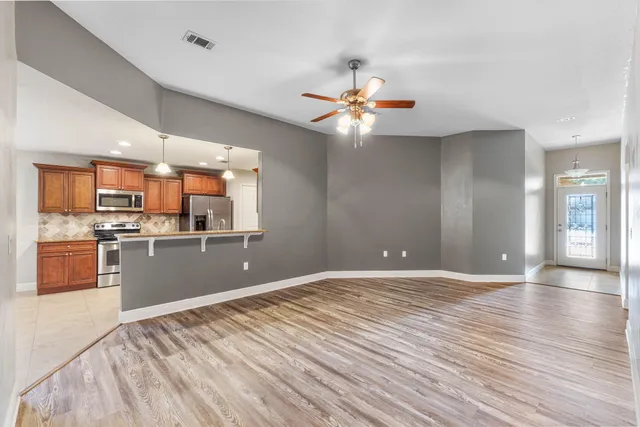 a view of a kitchen with a sink and a stove top oven