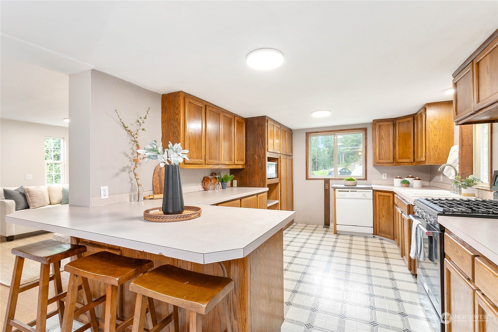 6040 Reese Hill Road Sumas, WA 98295 - Photo 12 of 34 a kitchen with granite countertop a sink cabinets and stainless steel appliances
