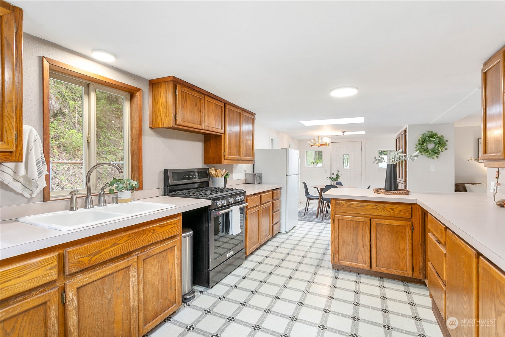 6040 Reese Hill Road Sumas, WA 98295 - Photo 15 of 34 a large kitchen with stainless steel appliances granite countertop a sink and cabinets
