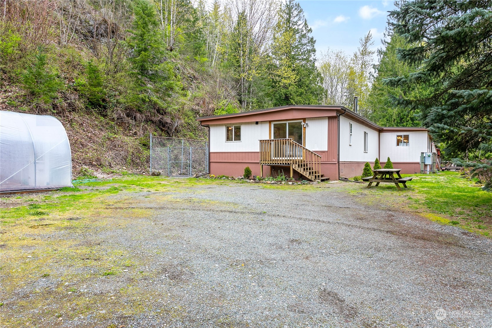6040 Reese Hill Road Sumas, WA 98295 - Photo 2 of 34 a front view of a house with a yard and trees