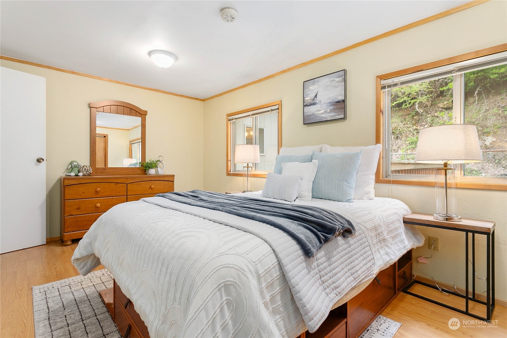 6040 Reese Hill Road Sumas, WA 98295 - Photo 21 of 34 a bedroom with a bed and wooden floor