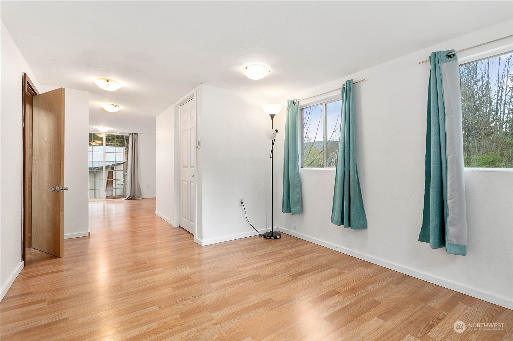 6040 Reese Hill Road Sumas, WA 98295 - Photo 25 of 34 a view of a big room with wooden floor and windows