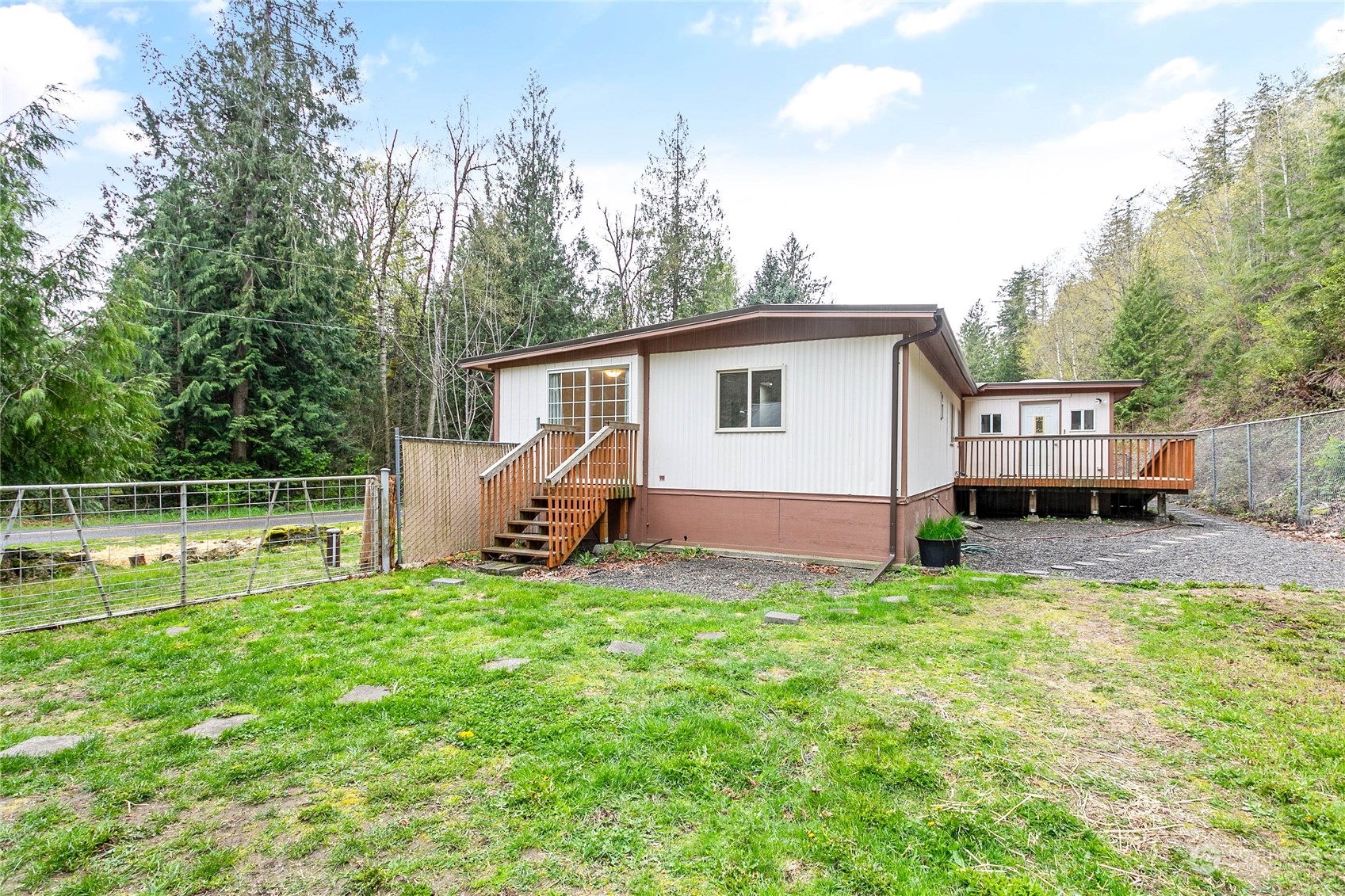 6040 Reese Hill Road Sumas, WA 98295 - Photo 31 of 34 a view of a house with a backyard and a patio