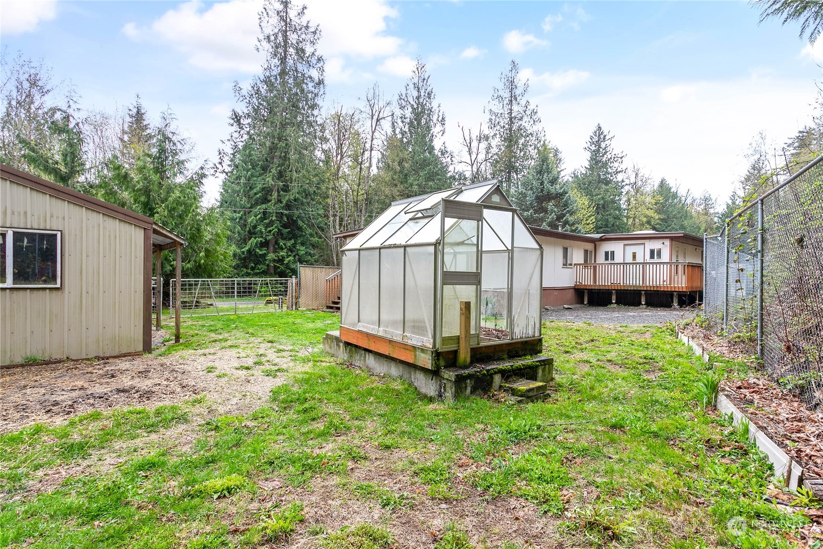 6040 Reese Hill Road Sumas, WA 98295 - Photo 33 of 34 a view of a house with backyard and trees