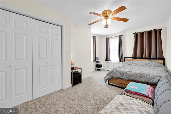 a bedroom with a bed and closet