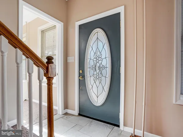 a view of a entryway with wooden floor and entryway