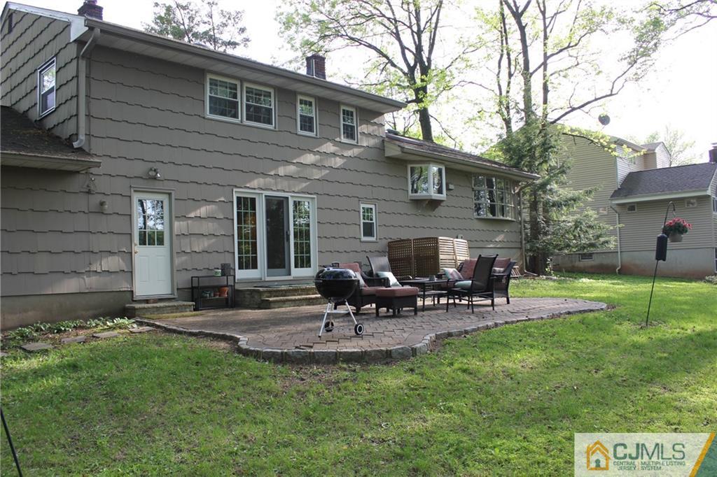 27 Huntington Road Edison, NJ 08820 - Photo 22 of 23 a view of a house with backyard porch and sitting area