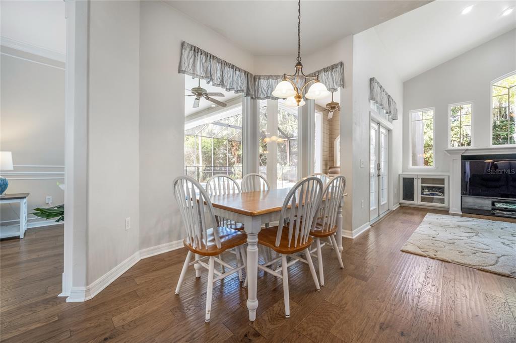 7146 Southwest 35th Avenue Gainesville, FL 32608 - Photo 12 of 83 a view of a dining room with furniture window and wooden floor