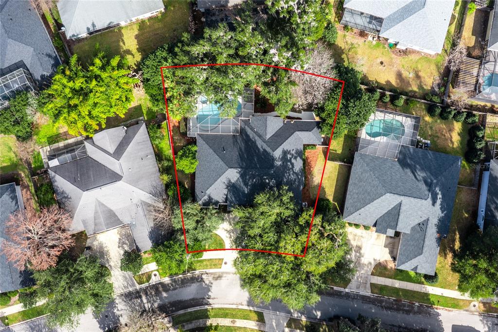 7146 Southwest 35th Avenue Gainesville, FL 32608 - Photo 3 of 83 an aerial view of a house with a yard and a large tree