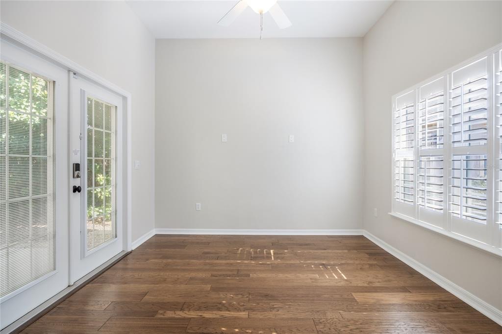 7146 Southwest 35th Avenue Gainesville, FL 32608 - Photo 31 of 83 a view of an empty room with wooden floor and a window