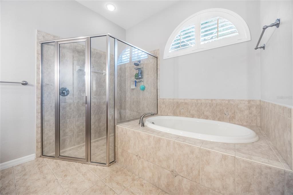 7146 Southwest 35th Avenue Gainesville, FL 32608 - Photo 46 of 83 a bathroom with a bathtub a shower and a sink
