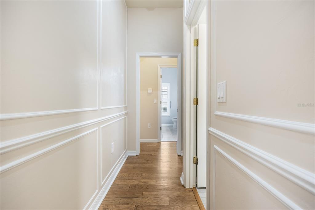 7146 Southwest 35th Avenue Gainesville, FL 32608 - Photo 49 of 83 a view of a hallway with wooden floor and staircase