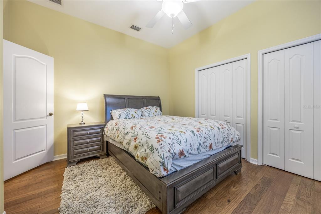 7146 Southwest 35th Avenue Gainesville, FL 32608 - Photo 51 of 83 a bedroom with a bed and wooden floor