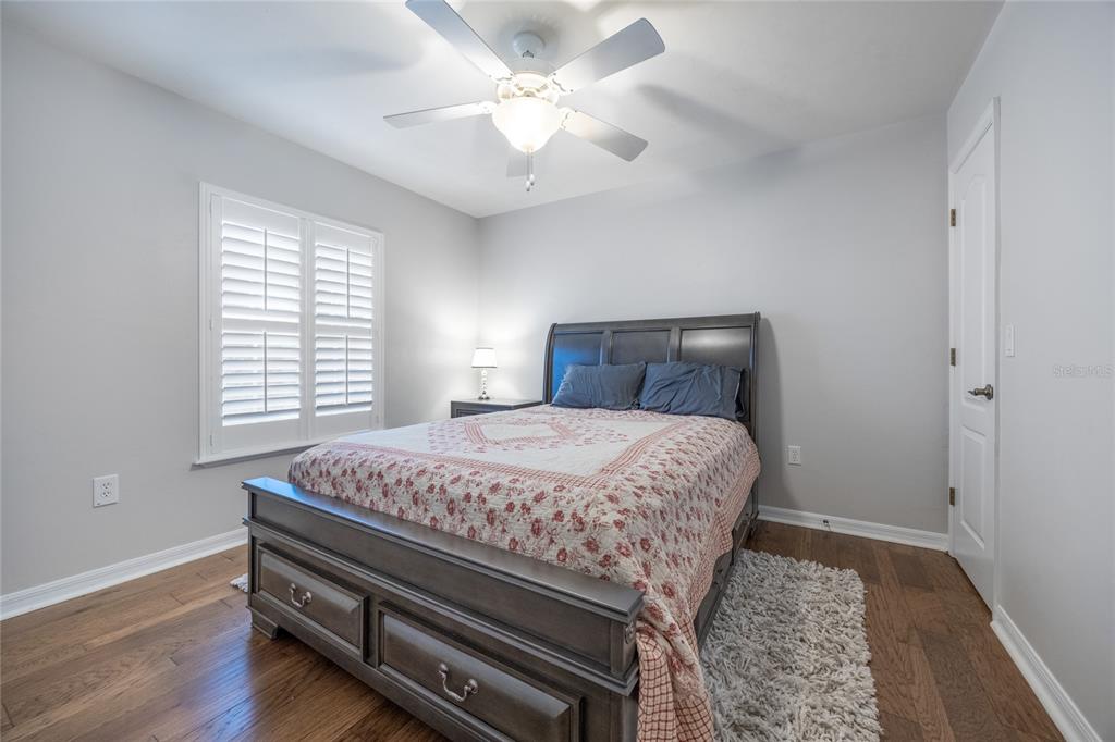 7146 Southwest 35th Avenue Gainesville, FL 32608 - Photo 55 of 83 a bedroom with a bed and a chandelier