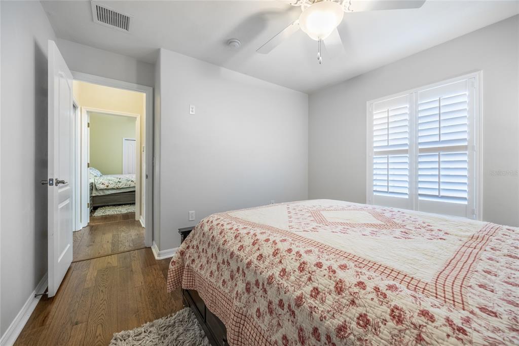 7146 Southwest 35th Avenue Gainesville, FL 32608 - Photo 56 of 83 a bedroom with a bed and a chandelier