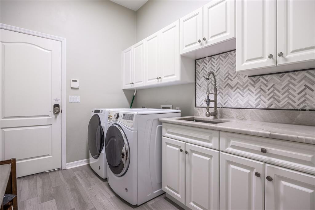 7146 Southwest 35th Avenue Gainesville, FL 32608 - Photo 64 of 83 a utility room with dryer and washer