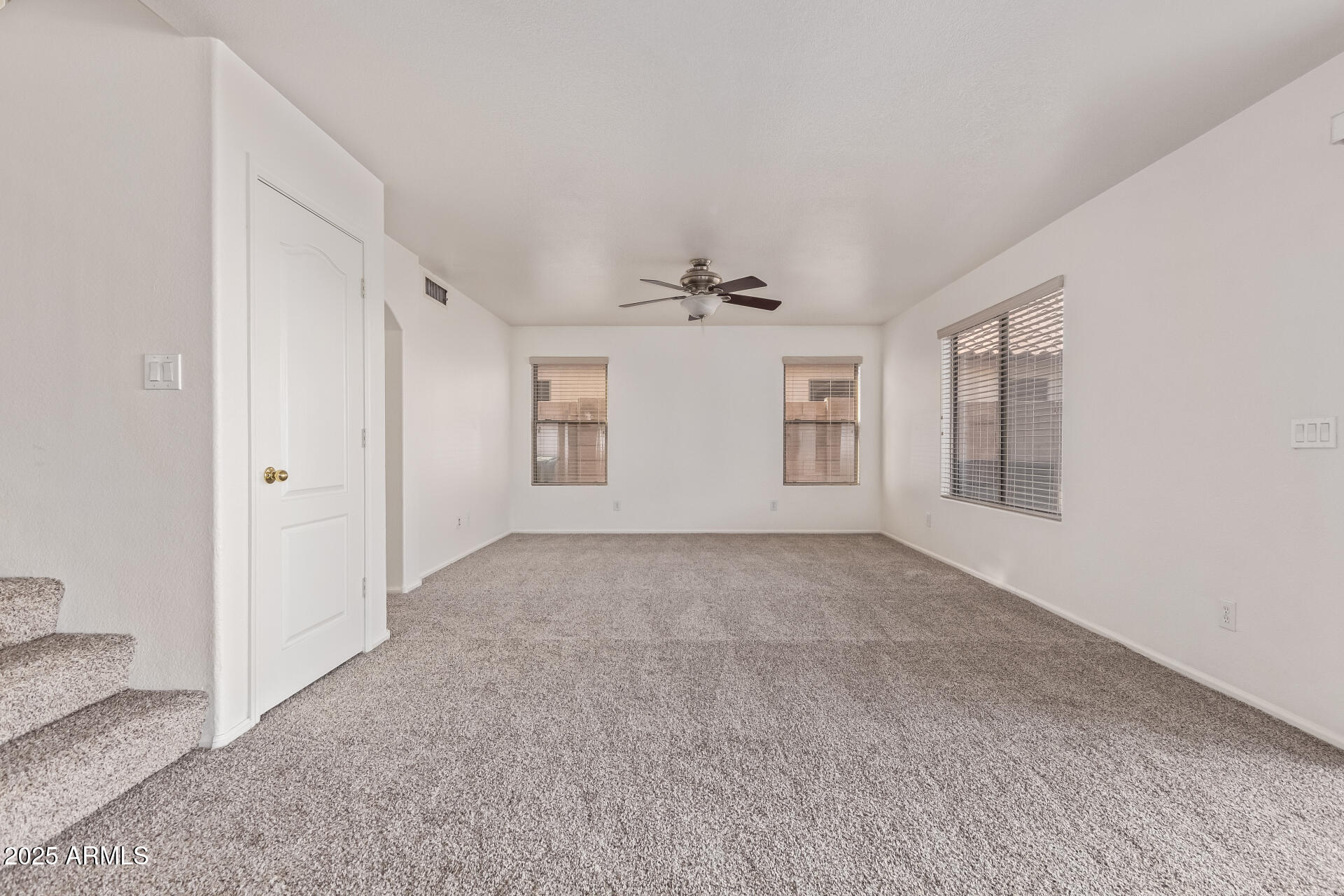 2432 West Blue Sky Drive Phoenix, AZ 85085 - Photo 12 of 40 a view of an empty room with a window