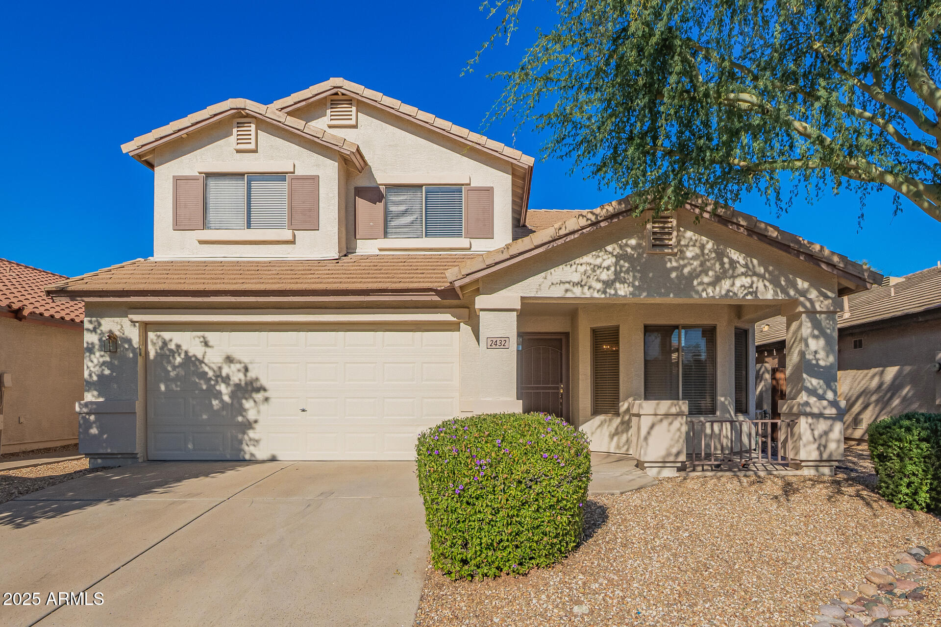 2432 West Blue Sky Drive Phoenix, AZ 85085 - Photo 2 of 40 a front view of a house with garden