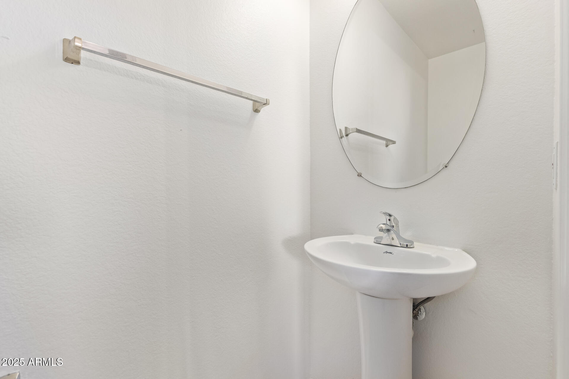 2432 West Blue Sky Drive Phoenix, AZ 85085 - Photo 21 of 40 a bathroom with a sink and a mirror