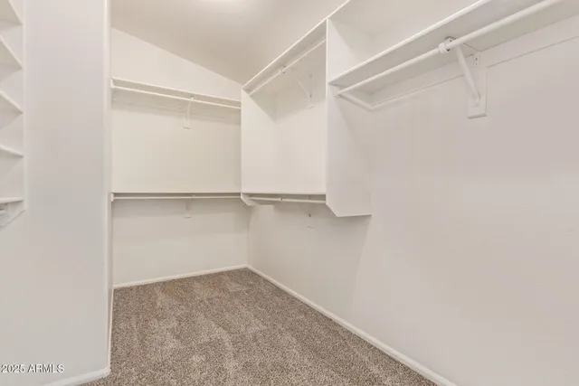 a view of an empty walk in closet