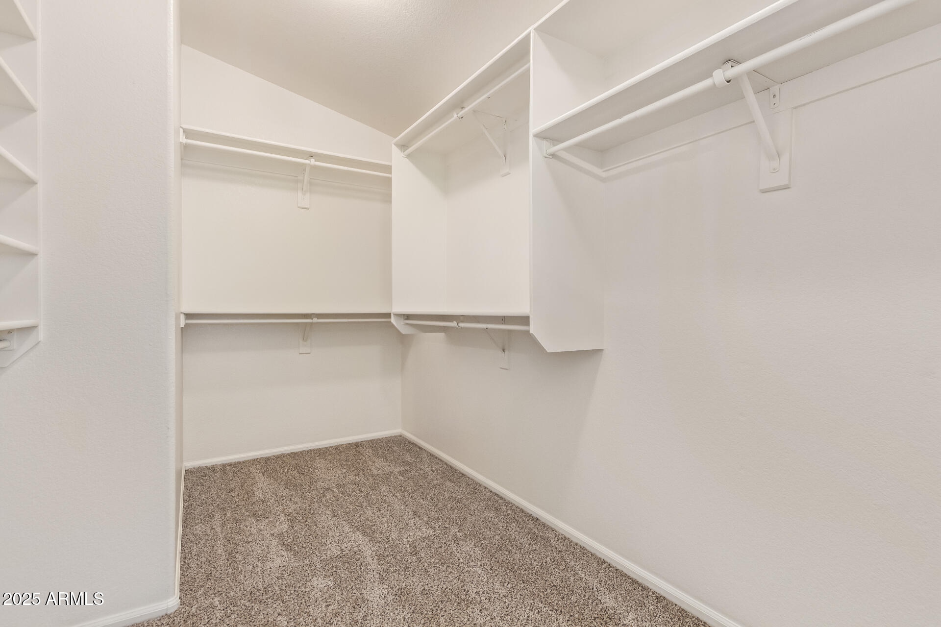 2432 West Blue Sky Drive Phoenix, AZ 85085 - Photo 28 of 40 a view of an empty walk in closet