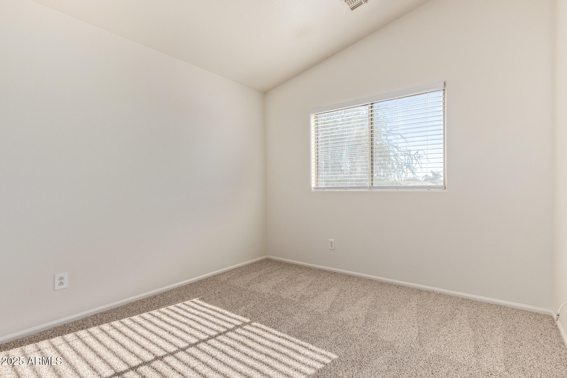 2432 West Blue Sky Drive Phoenix, AZ 85085 - Photo 34 of 40 an empty room with windows