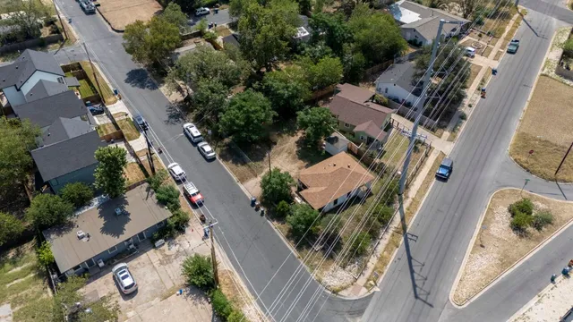 an aerial view of residential houses with outdoor space