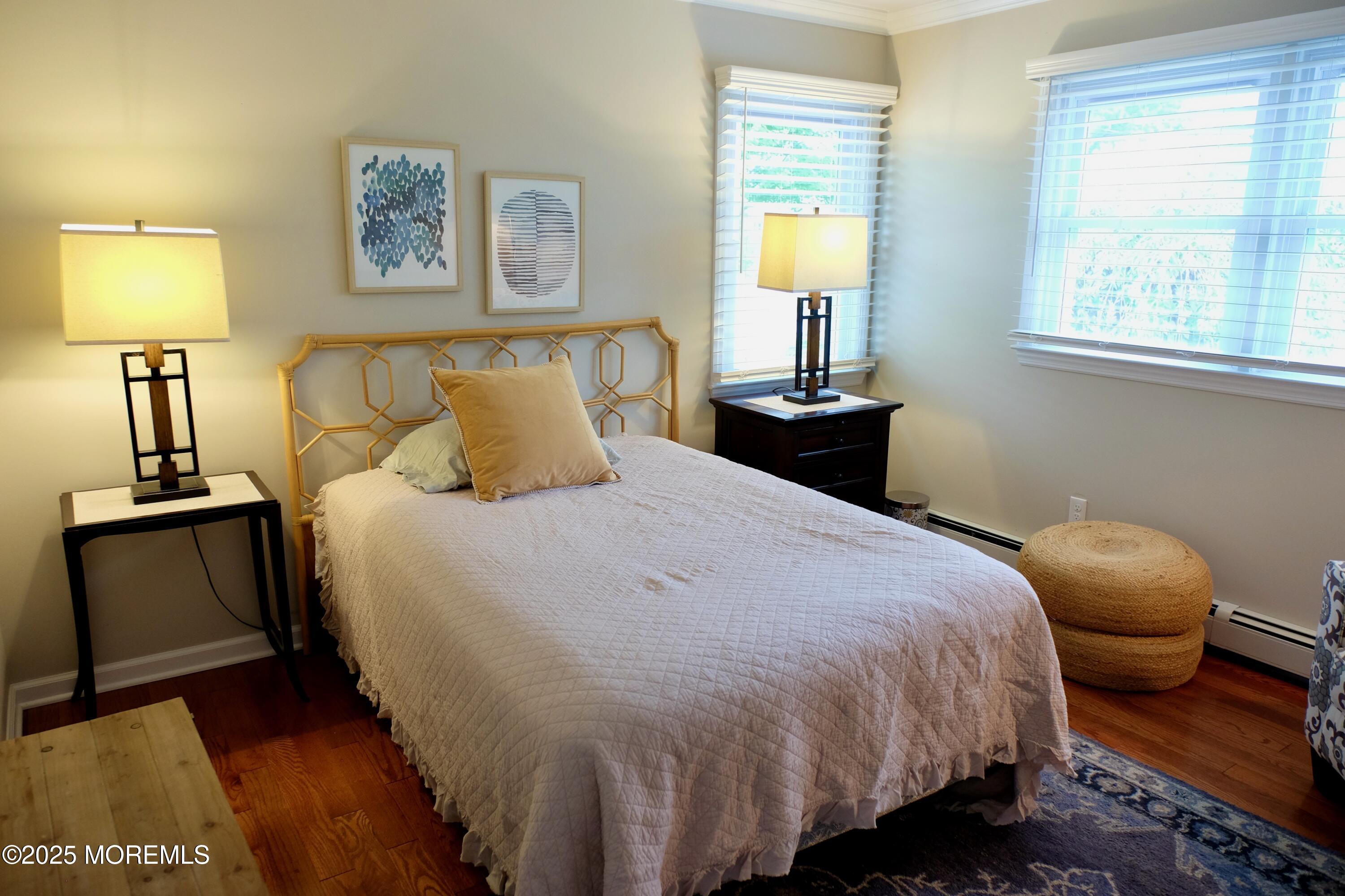 539 Woodland Avenue Brielle, NJ 08730 - Photo 14 of 19 a bedroom with a bed and wooden floor