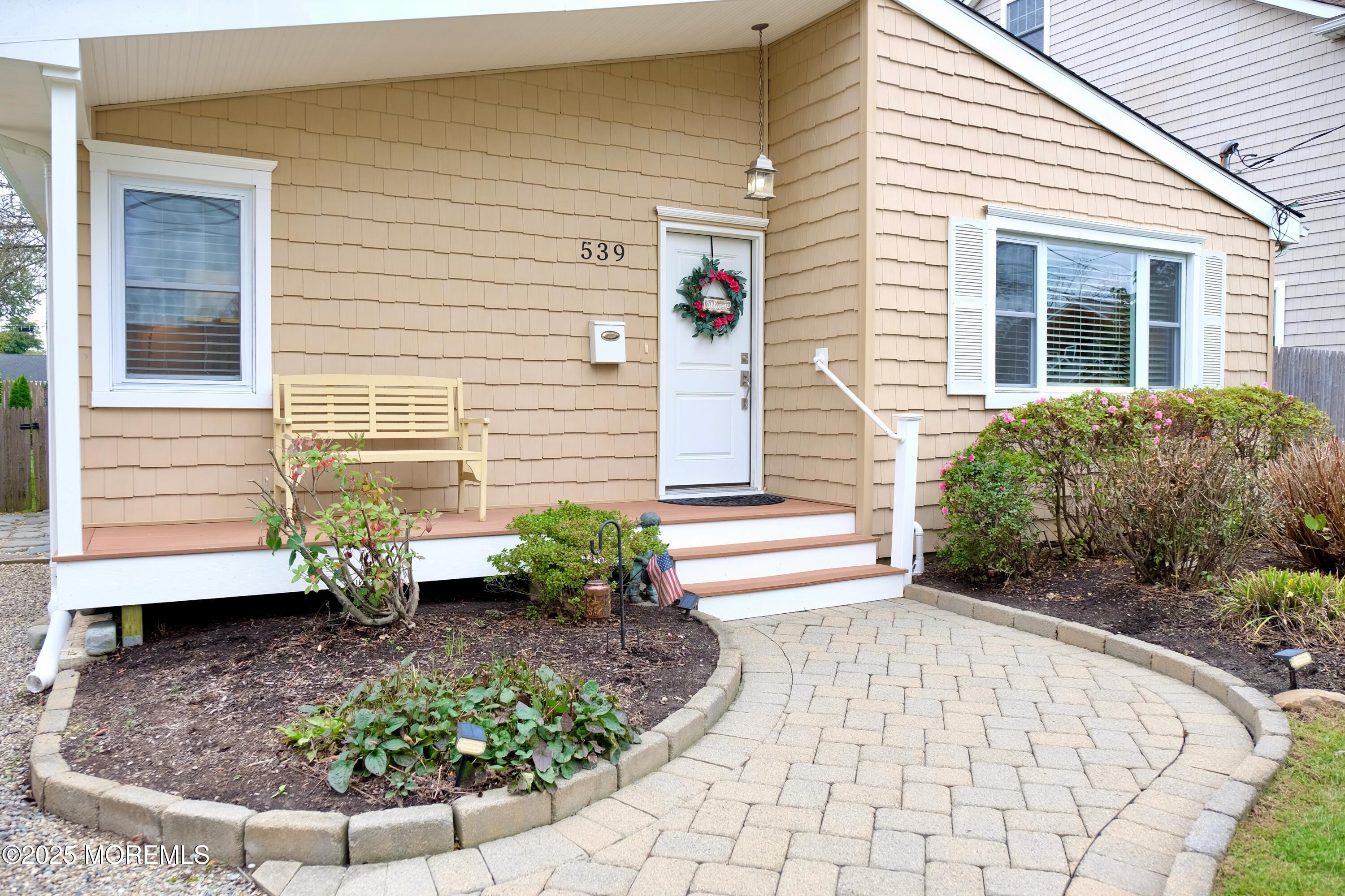 539 Woodland Avenue Brielle, NJ 08730 - Photo 2 of 19 a view of a backyard with seating space