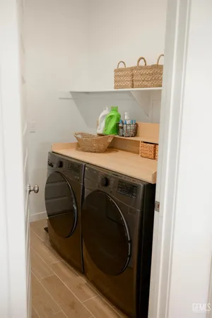 a view of a patio with couches and a potted plant on a table