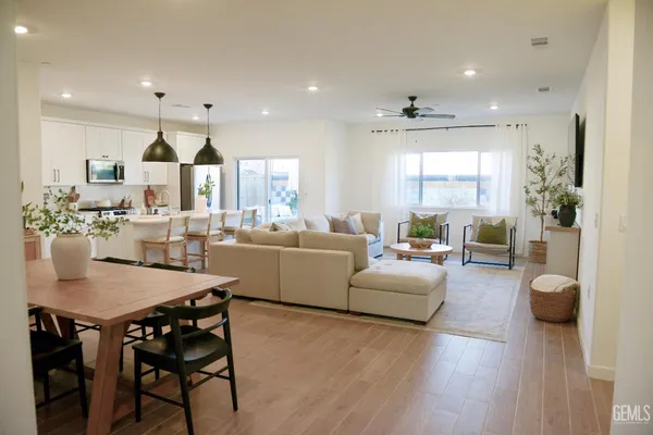 a view of a dining room with furniture and wooden floor