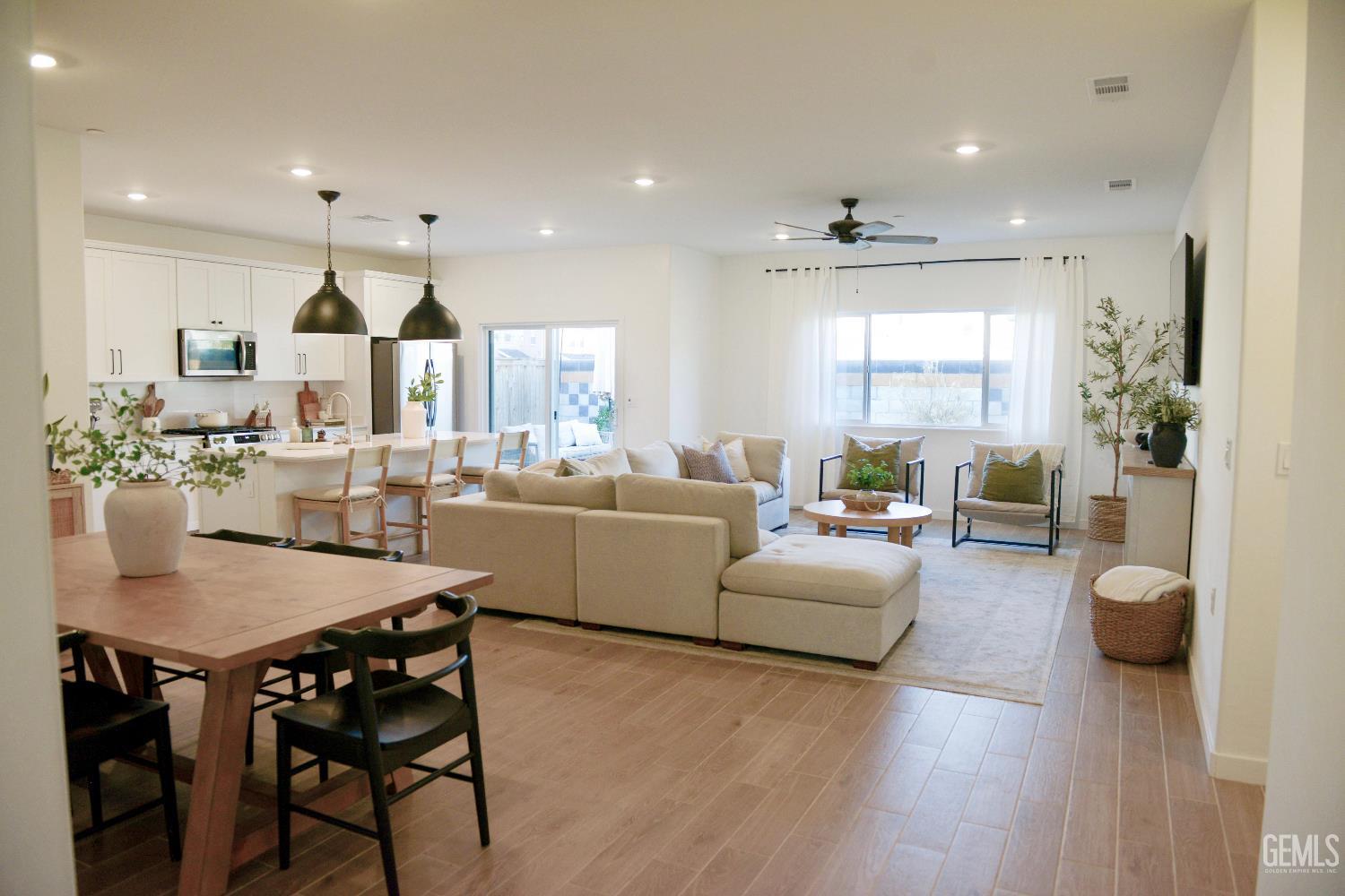 Undisclosed Address Shafter, CA 93263 - Photo 3 of 23 a view of a dining room with furniture and wooden floor