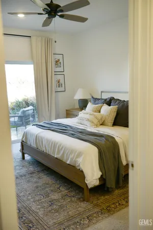 a bedroom with a bed and window