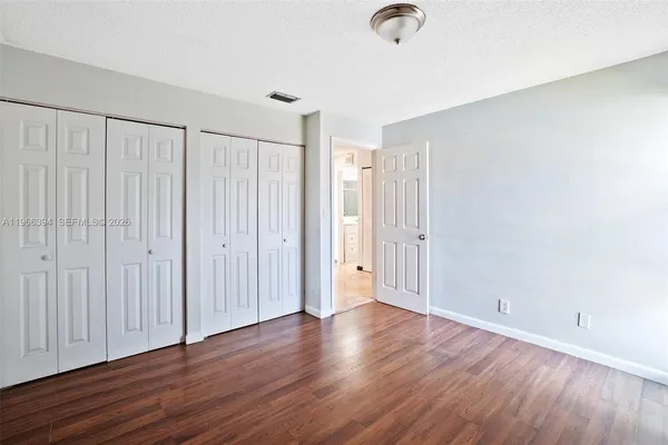 a view of a livingroom with wooden floor